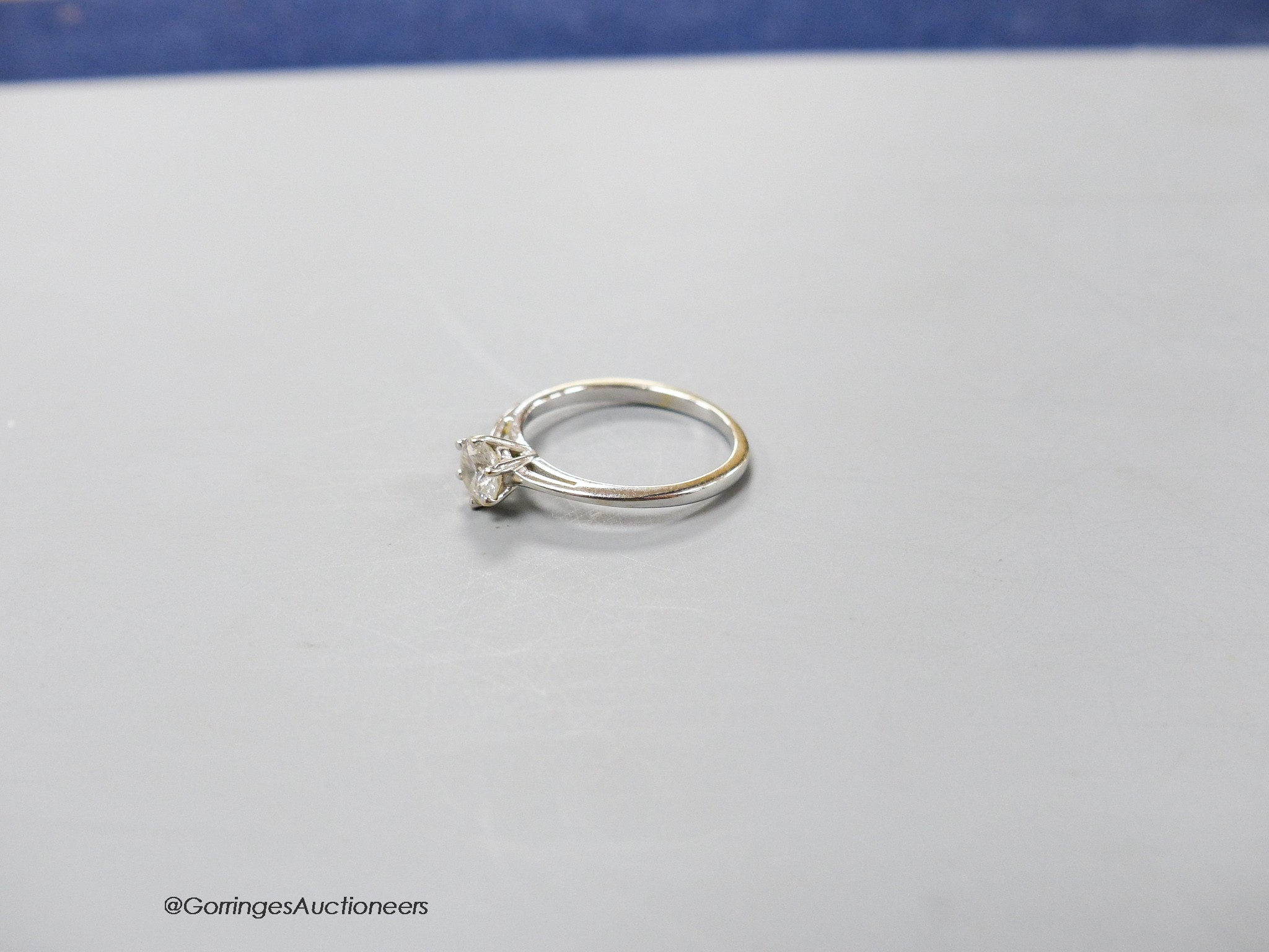 An 18ct white gold and solitaire diamond ring, size K/L, gross 2.2 grams.